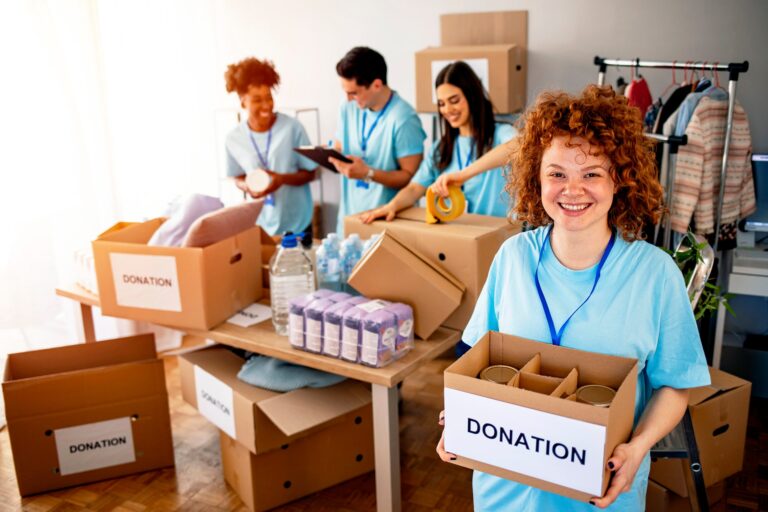 Volunteers packing and carrying donation boxes