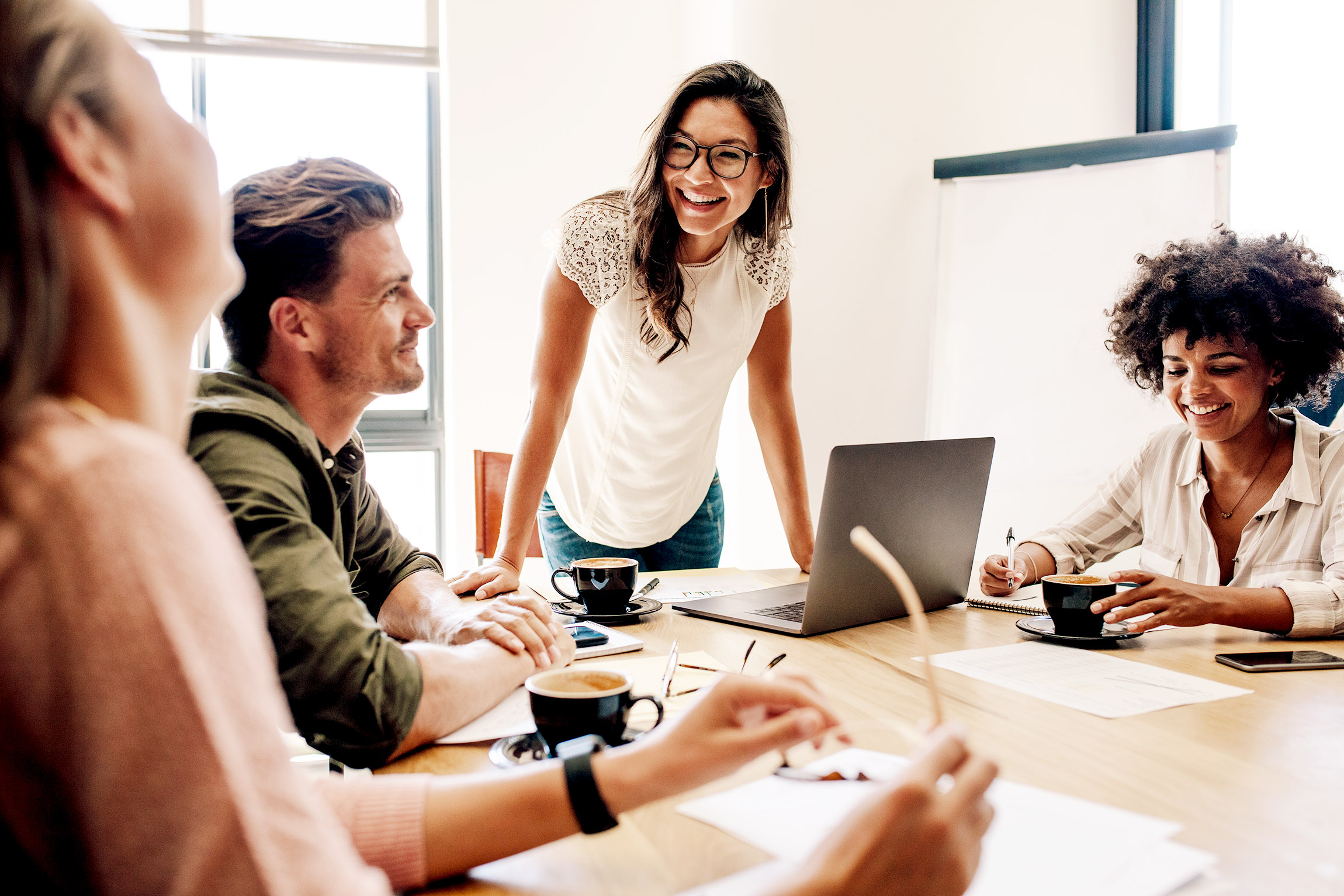 Colleagues smiling during a team meeting